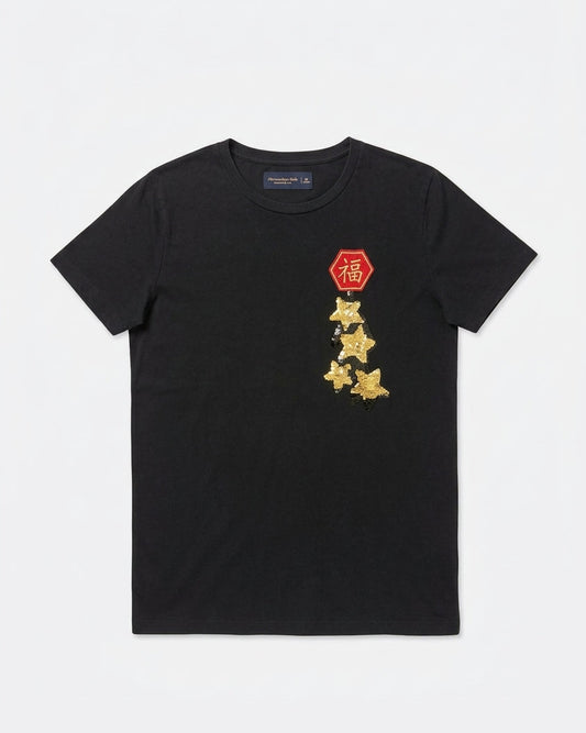 Black Abercrombie & Fitch short-sleeve t-shirt with a red hexagonal Fu patch above gold flip-sequin stars on the left chest laid flat, front view