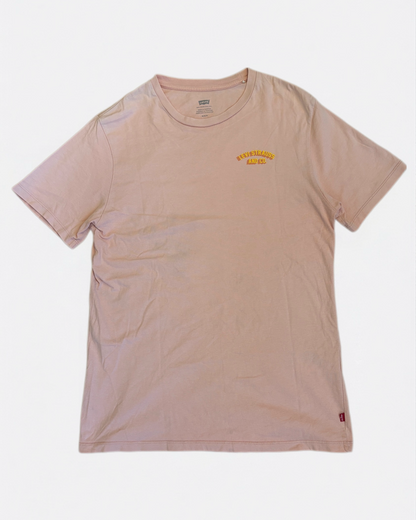 Dusty pink Levi Strauss and Co. t-shirt featuring small yellow logo on the left chest, front view