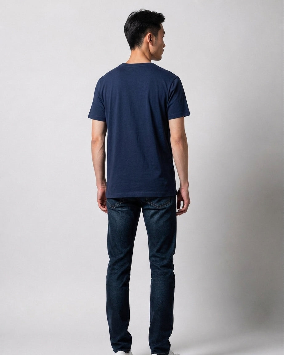 Man wearing a plain navy blue Rugby World Cup 2019 t-shirt seen from behind, styled