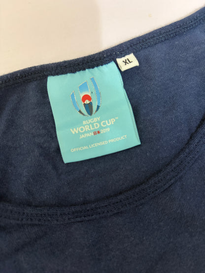Close-up detail of the light blue Rugby World Cup Japan 2019 official licensed product neck label and size XL tag