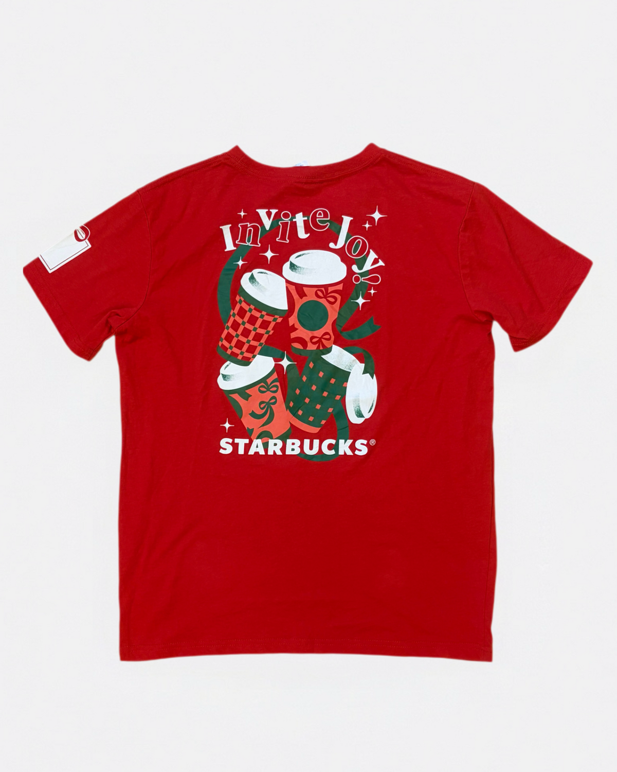 Red Starbucks Invite Joy holiday t-shirt featuring graphic print of festive coffee cups and white Starbucks logo, back view