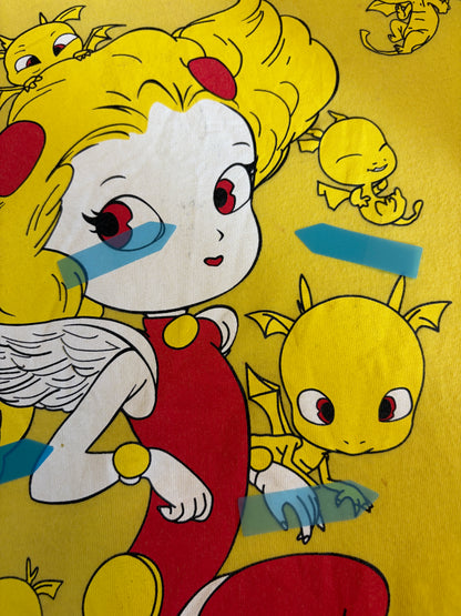 Close-up view of the graphic print on a yellow Yoshitaka Amano 24 Hour Television 2014 charity t-shirt showing slight stain defects marked with blue stickers.